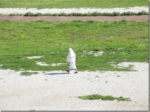 nun-walking-in-the-circus-maximus
